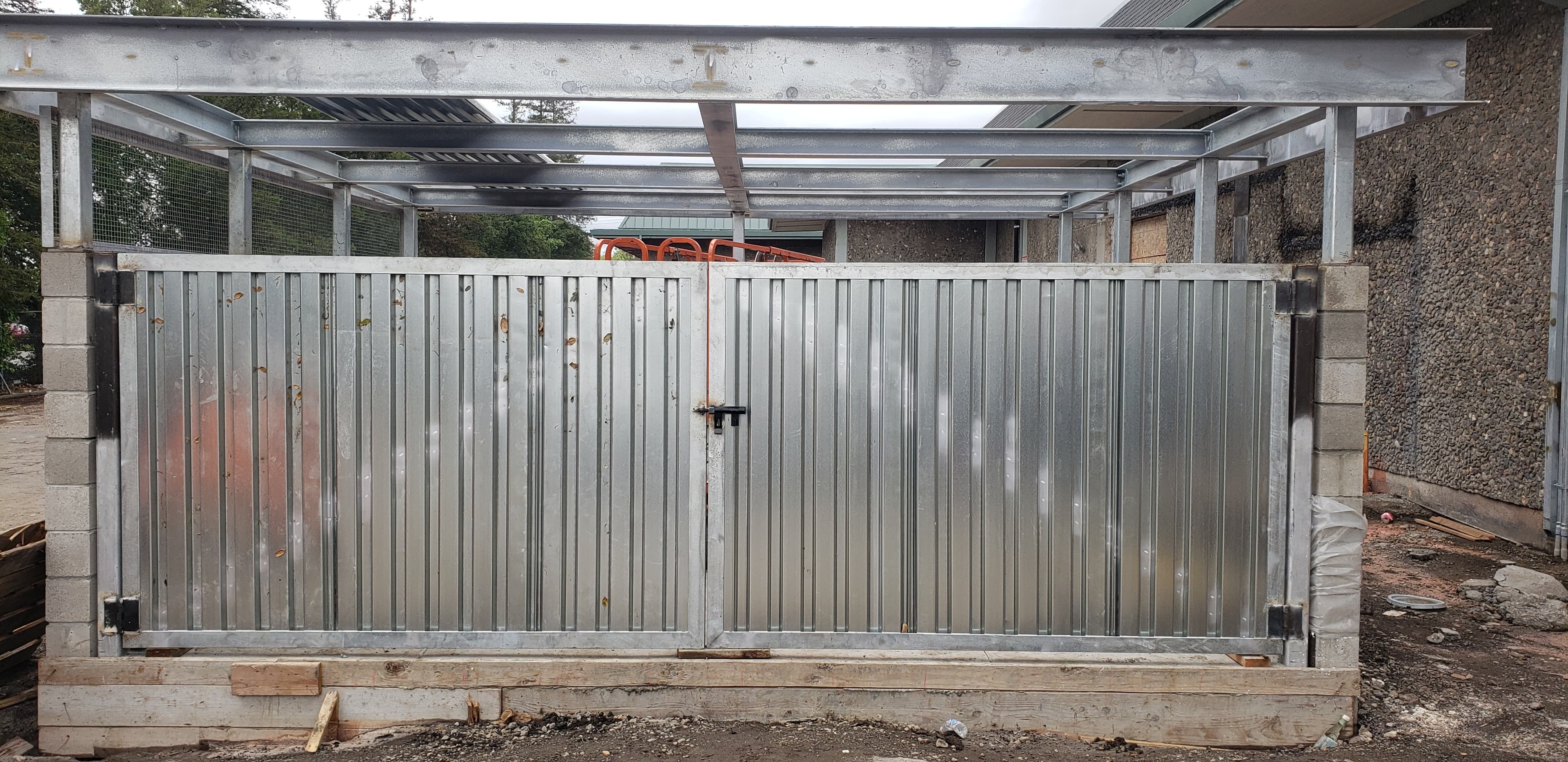 AUTOZONE — Galvanized steel enclosure gates and overhead framing for a new retail location.