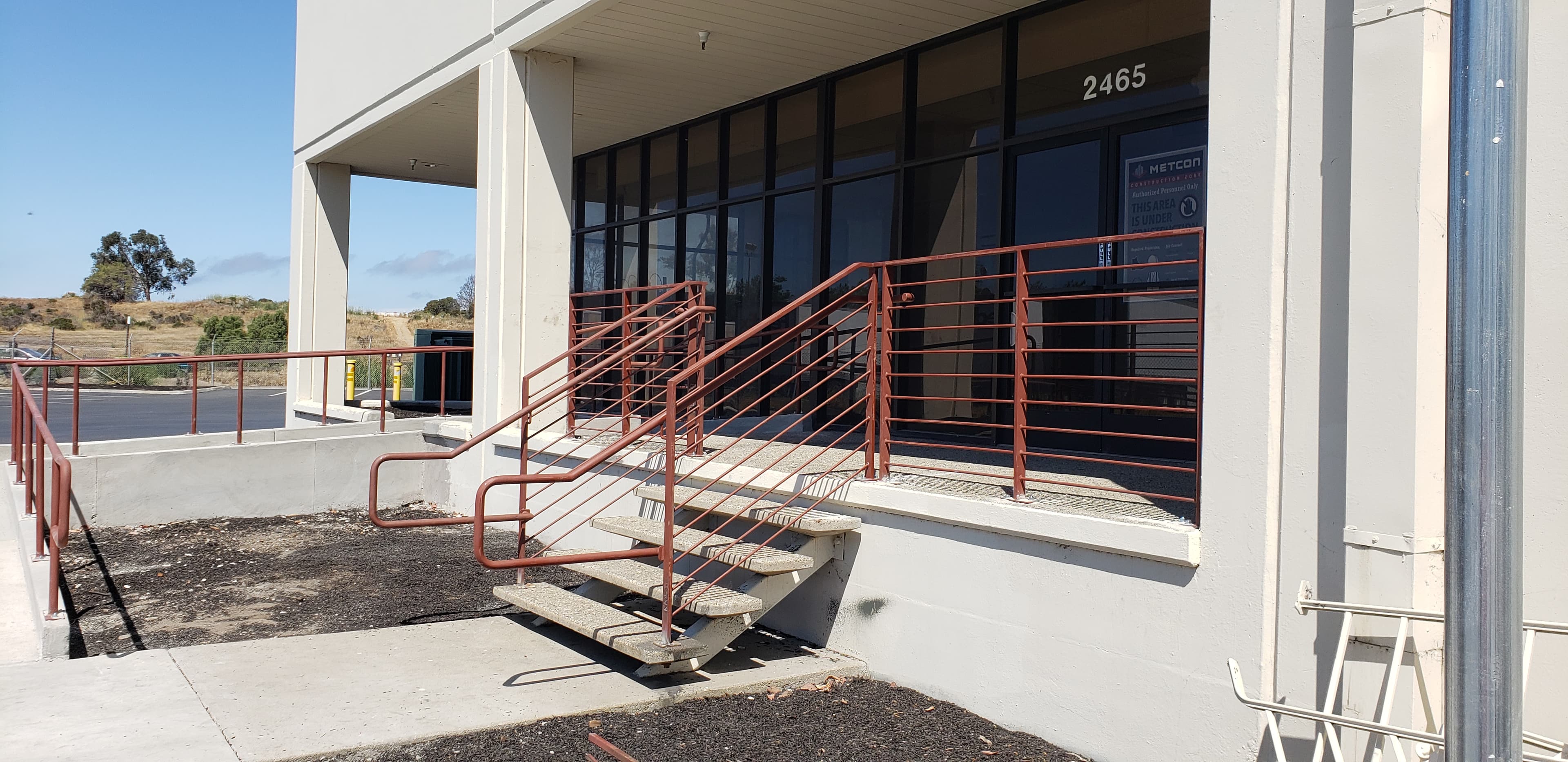 FEDEX — Exterior steel handrails and guardrails for building entries and accessible ramps.
